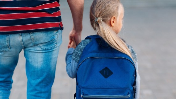 Parent holding hands with child