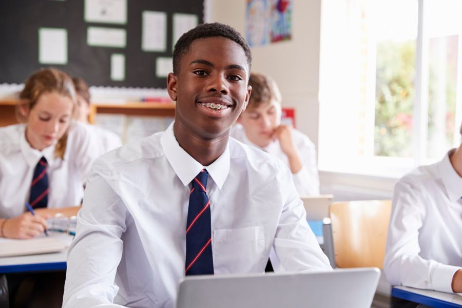 A teenage pupil in their classroom