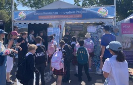 Group of children stood in front of the DRIP stall at the devon county show