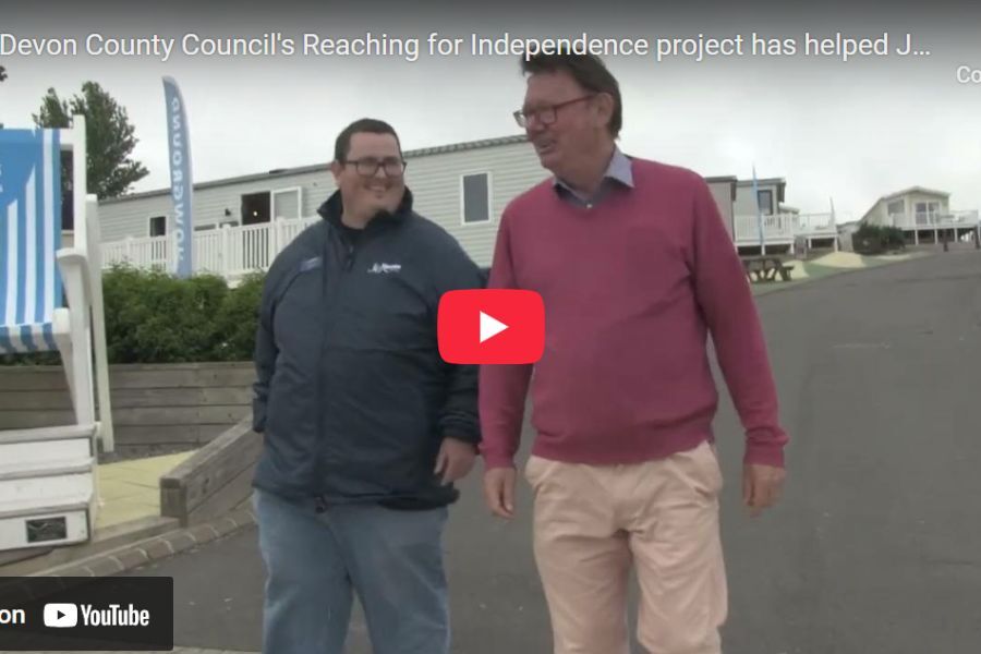 James, with the community enabler, Paul, from the council's Reaching for Independence team, walking together at James' place of work