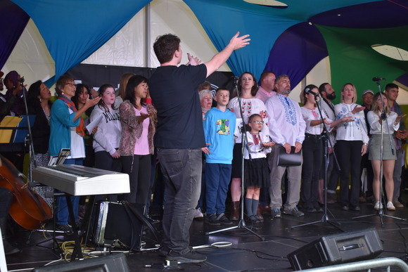 Multilingual choir performing at Exeter Respect Festival