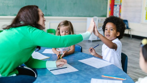 Teacher in classroom with pupils