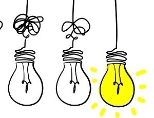 Series of lightbulbs with unravelling flex and the last bulb lit