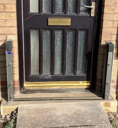 A property door with a flood barrier installed
