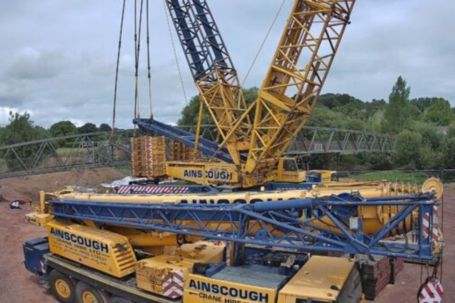 A large crane at work at the site of the Coleridge bridge in Ottery St Mary