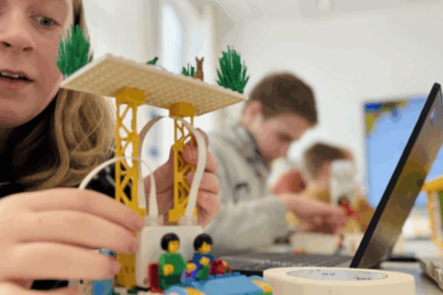 Children at the library involved with making lego models