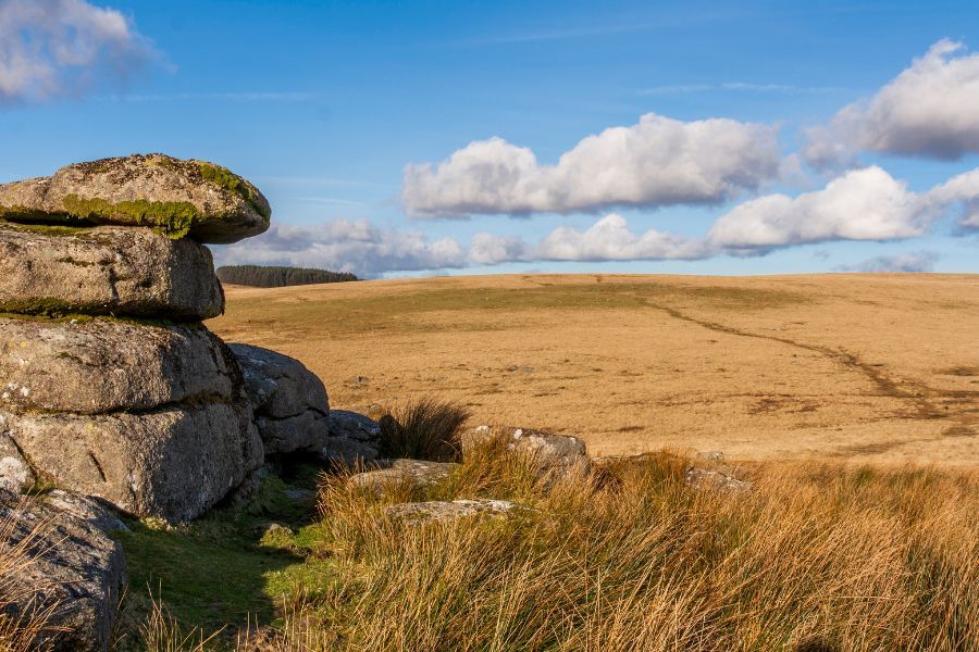 Dartmoor, with rolling moor land, with a bright blue sky