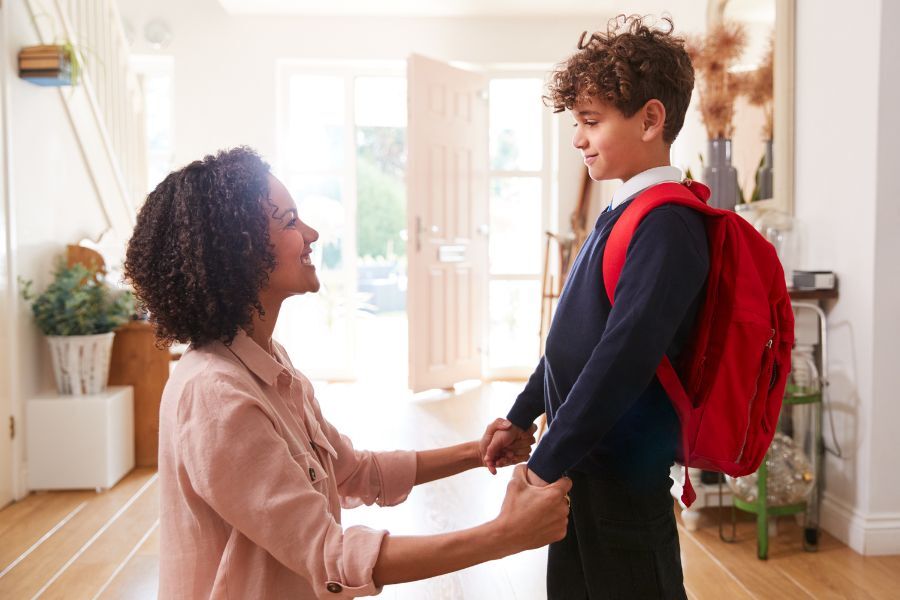 Boy in uniform with mother