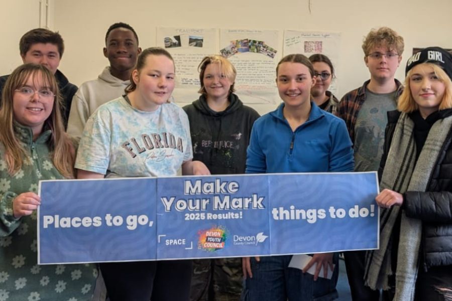 Young people holding 'Places to Go' sign
