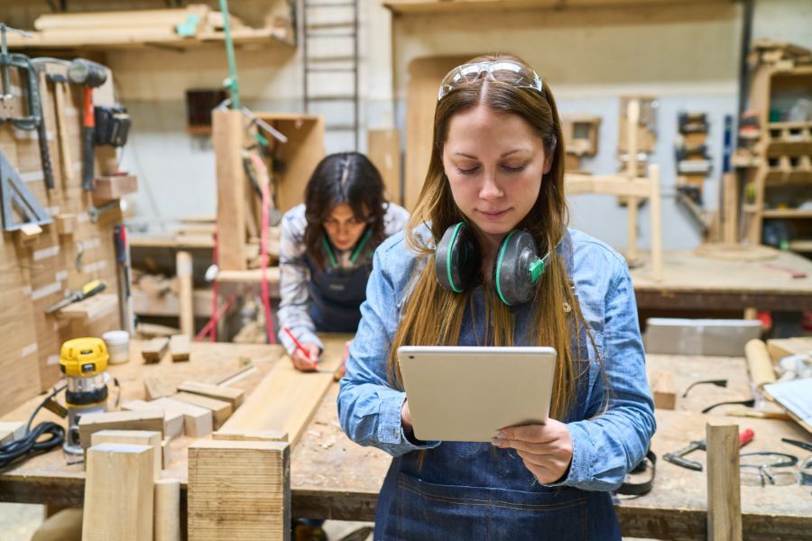 A young person working in a joiners workshop