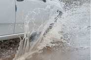 Car driving through flood water