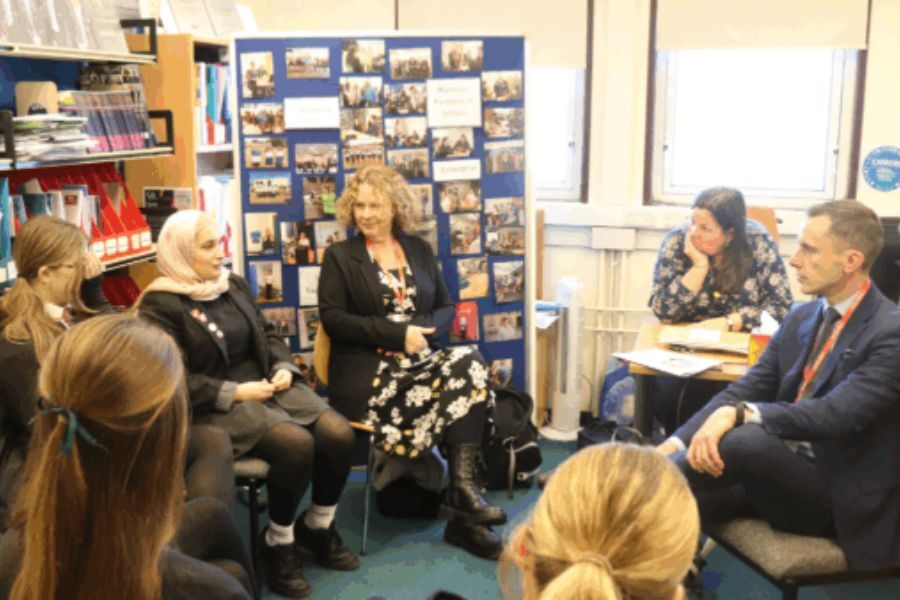 People sat talking in an office