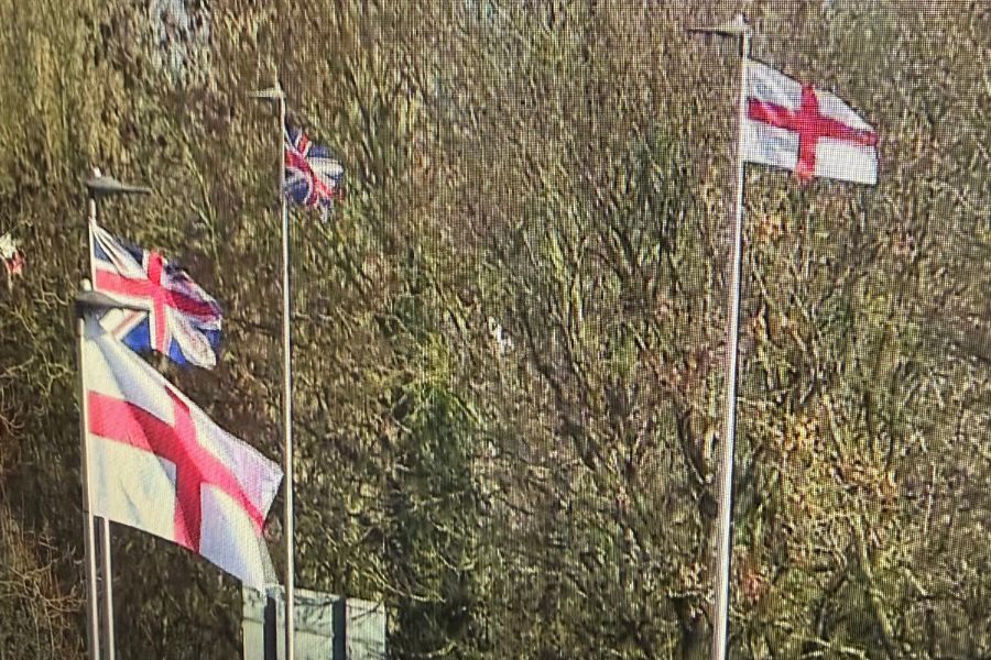 CCTV still image of Union flags flying from streetlights