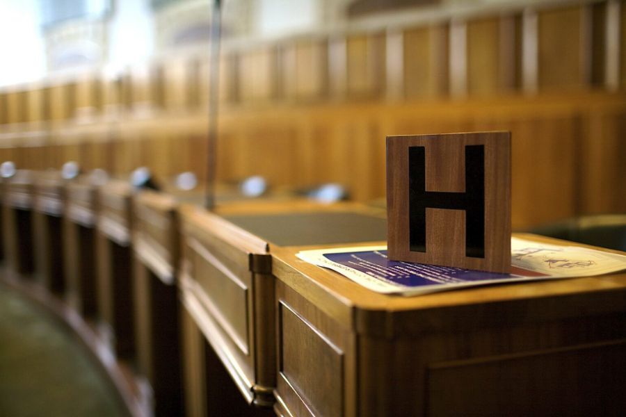 Picture of a gavel on a wooden desk 