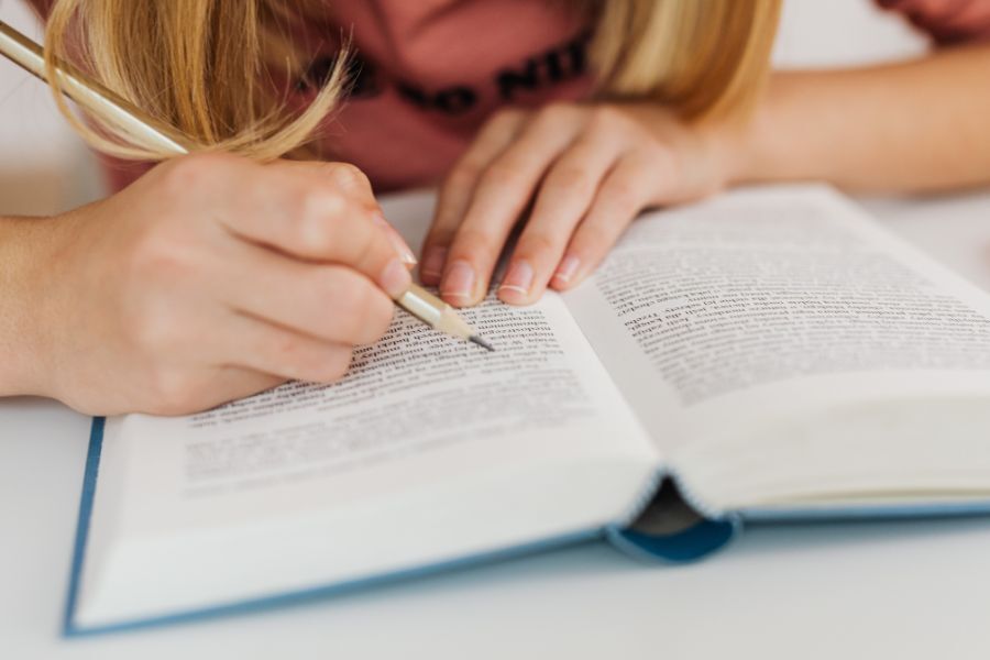 A child writing in her school book