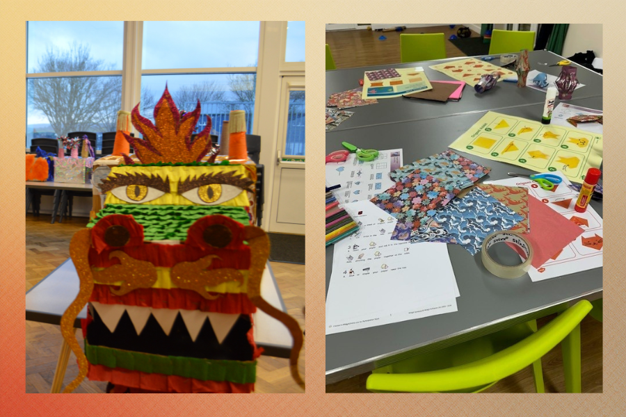 Handmade dragon craft displayed beside a table of colourful art materials used during a SEND family activity.