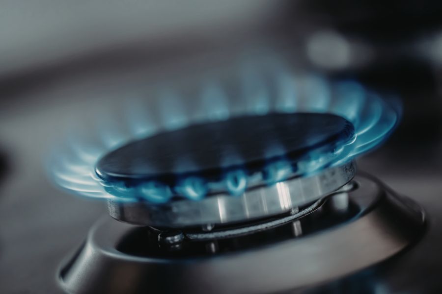 A lit gas hob, with flames ready to put a pan on.