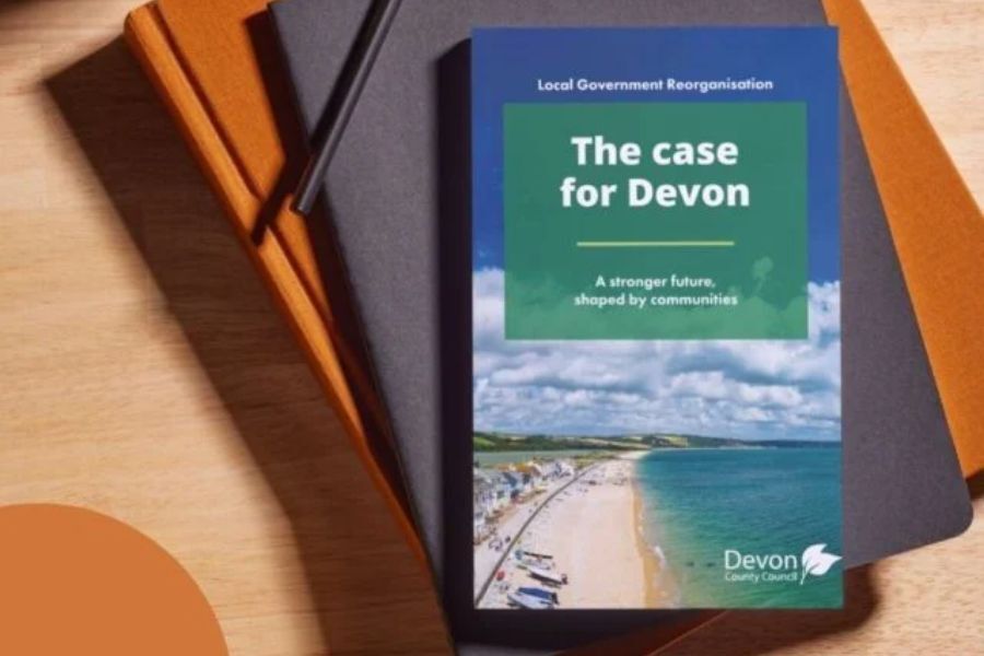 The LGR document, entitled The Case For Devon. The document is on the top of a pile of folders