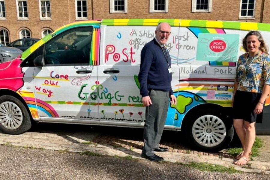 Councillor Cottle-Hunkin (right) and Cllr Rogers (left) standing in front of Cllr Rogers' mobile post office van, parked at County Hall, Exeter.
