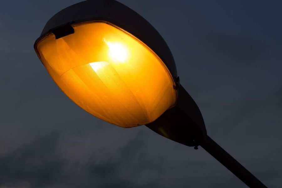 A lit street light, glowing at night