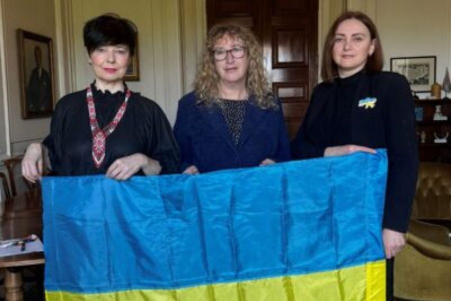 The Chair of the Council with two of the founding members of the Devon Ukrainian Association holding the Ukrainian flag between them