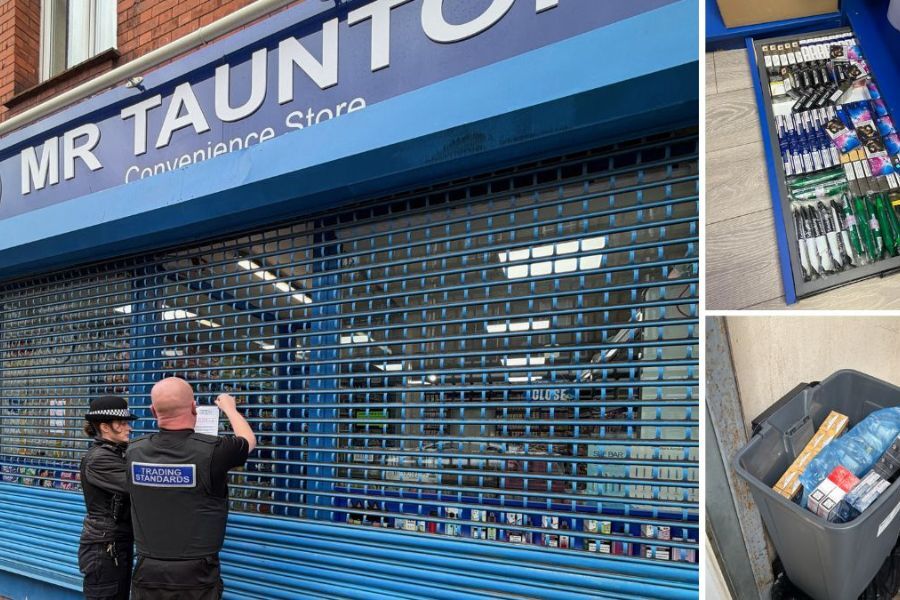 Two officers stood outside a locked up shop in Taunton