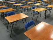 Empty exam hall desks 
