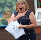 A teacher reacts to her Silver Teaching Award