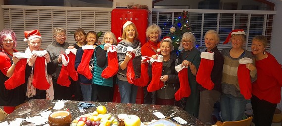 MOOL volunteers with christmas stockings