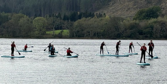 Young People Paddleboarding