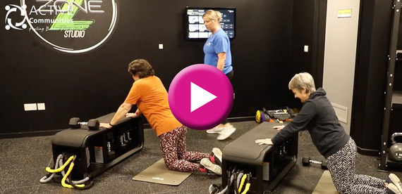 Fitness video still showing ladies doing gym exercise