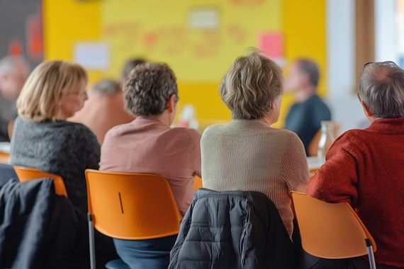 People in a meeting sitting down