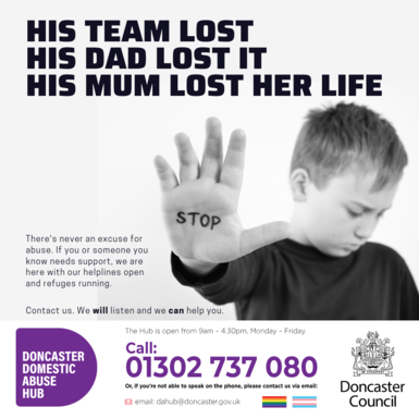 Child looking sad holding hand up to camera