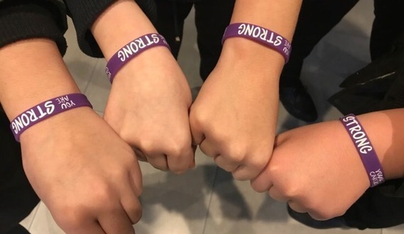 Young carers hands together 