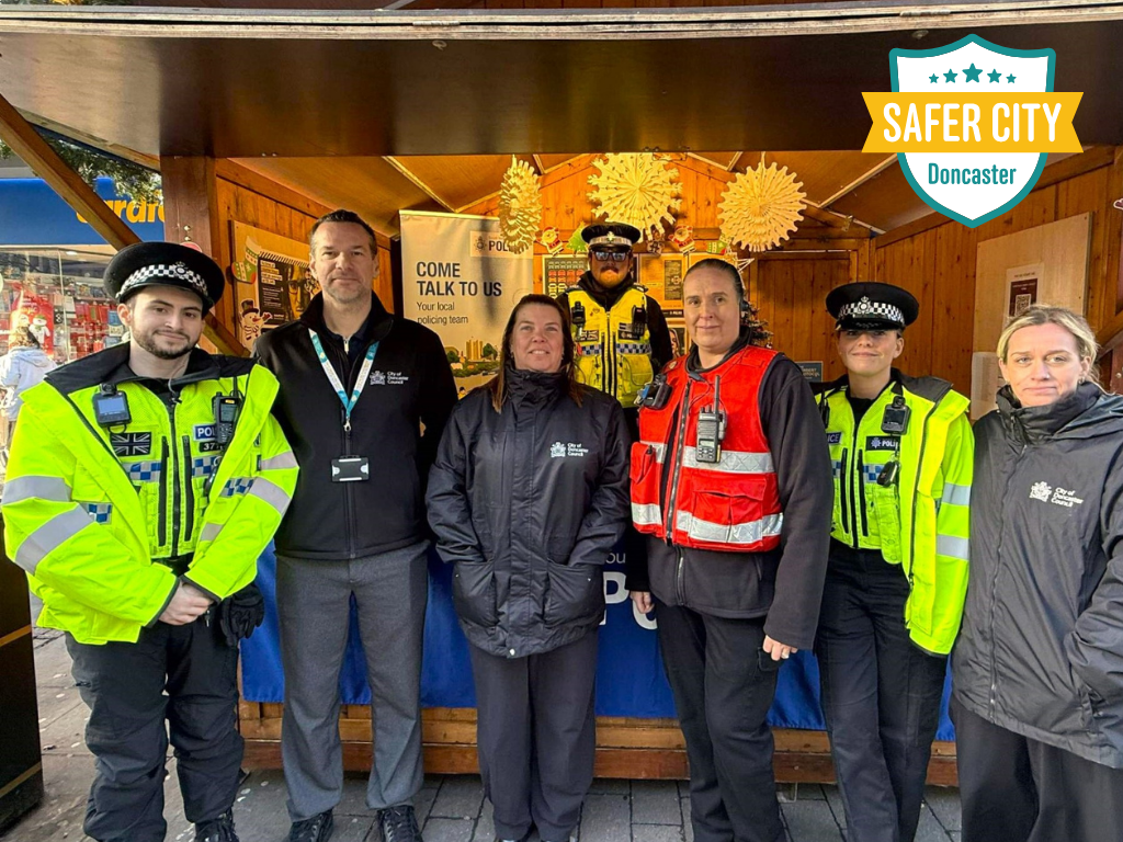Image shows officers at the Safer City Christmas Cabins