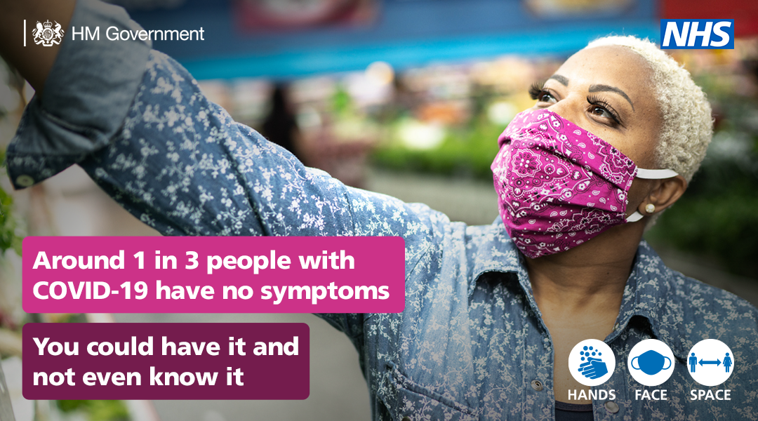 a woman wearing a face covering in a supermarket - 1 in 3 have coronavirus without having any symptoms 