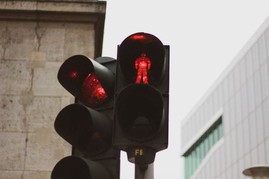 Red traffic light and red pedestrian sign