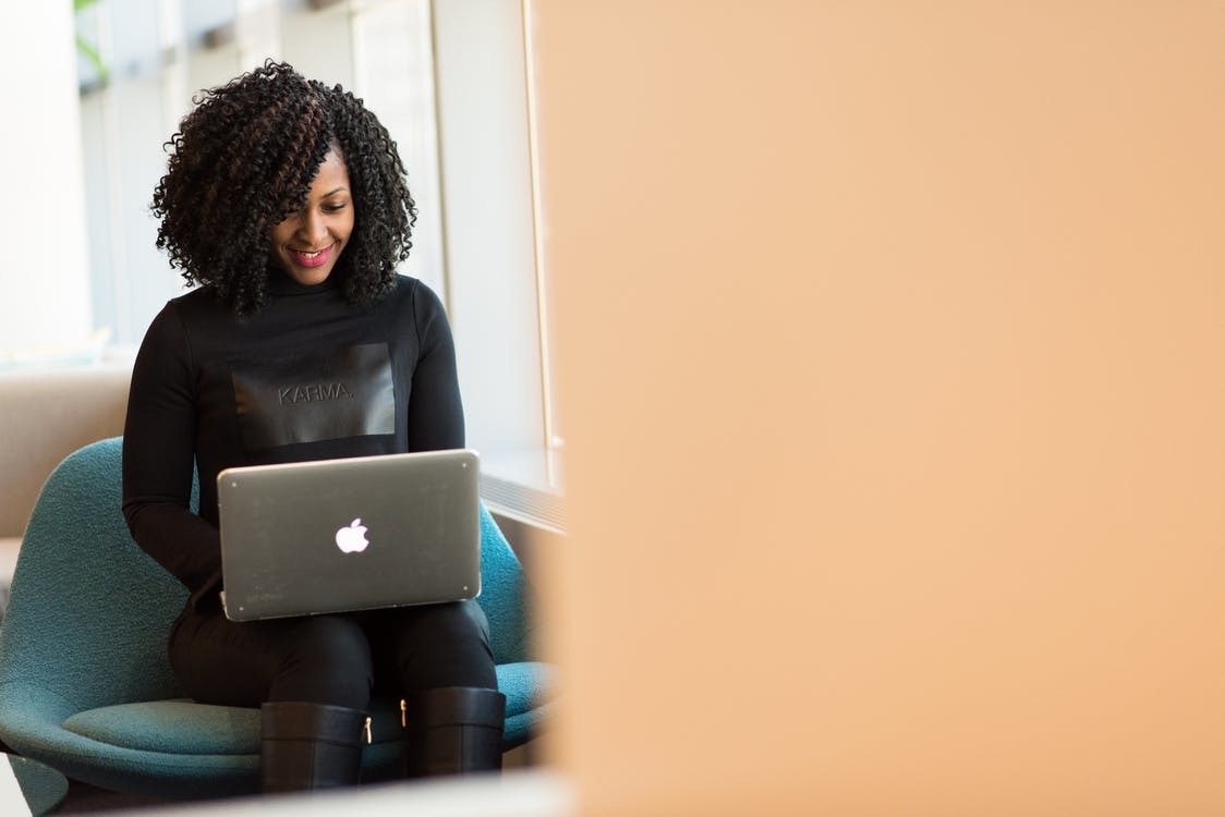 woman sitting down with laptop 