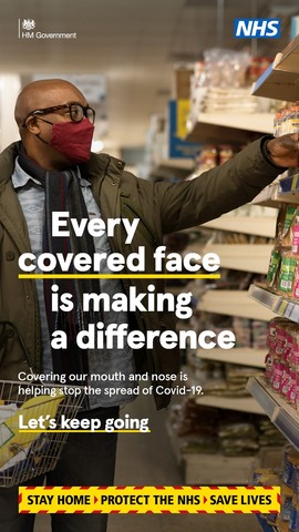 man wearing a face covering shopping 