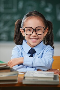 Young child in school uniform