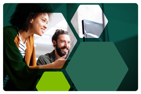 ITS professionals working together on computers.