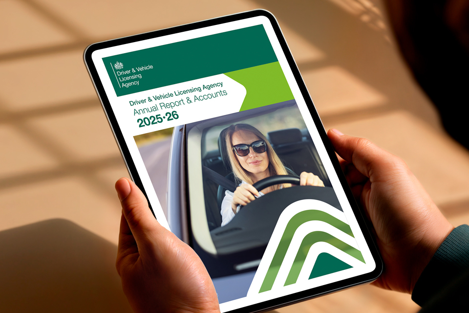 Person the reading annual report & accounts on a tablet.