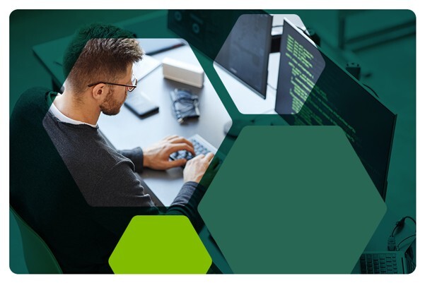 Man sitting at desk using a keyboard