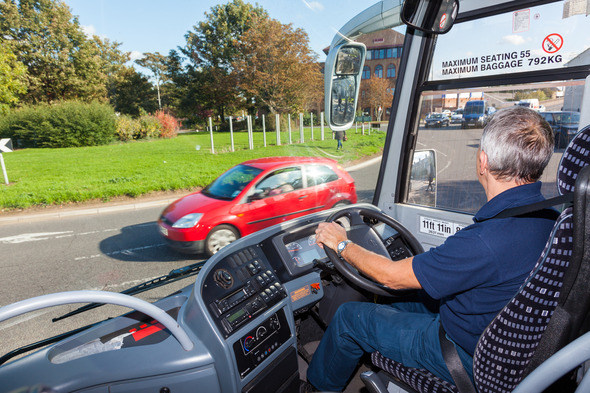 Man driving a coach 