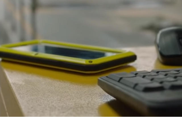 Phone and keyboard on desk