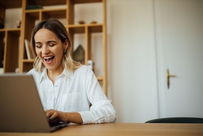happy woman using laptop