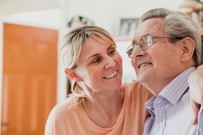 woman caring for elderly man