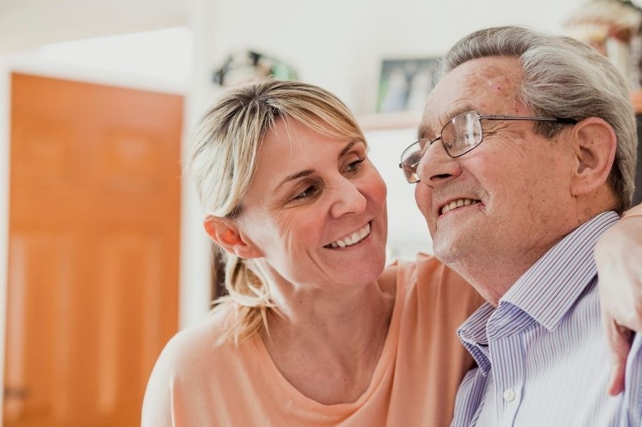 woman caring for elderly man
