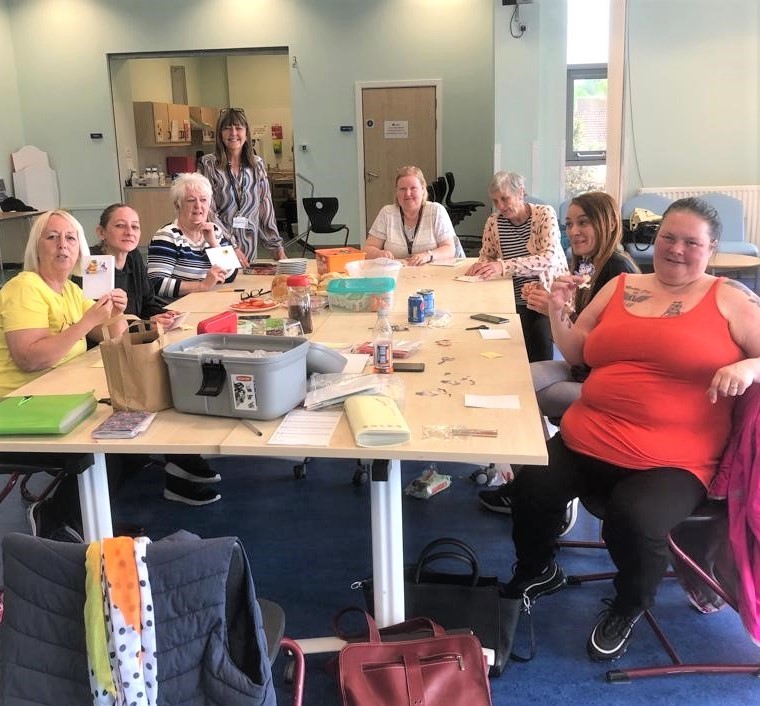 Members of the Women of Worth group enjoying a card making session