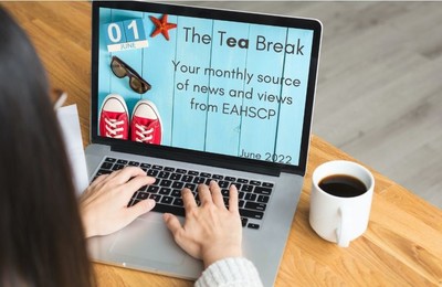 Person using laptop with our June newsletter header image displayed